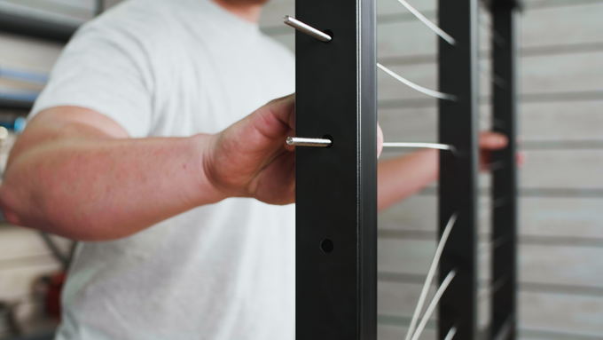 Thru-Post-Tensioners-in-Metal-Posts-place-stud-through-termination-post-close-up -Thru-Post-Tensioners-in-Metal-Posts-place-stud-through-termination-post-close-up