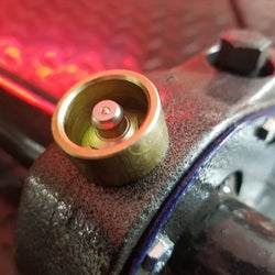 Speedbinders-replacement-Grease-Zerk-Fittings-and-Protectors-installed-view-on-trailer-deck Speedbinders-replacement-Grease-Zerk-Fittings-and-Protectors-installed-view-on-trailer-deck