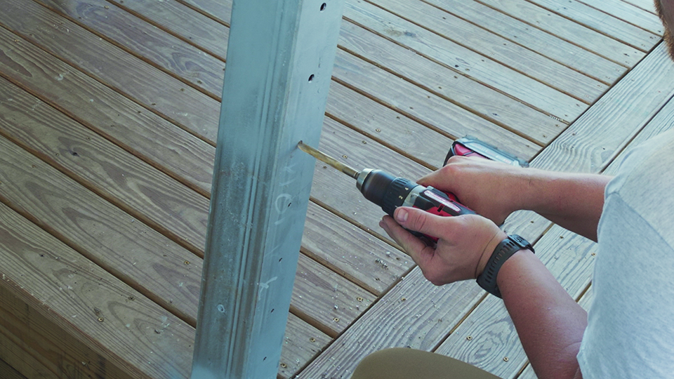 drilling-holes-metal-posts-cable-railing drilling-holes-metal-posts-cable-railing
